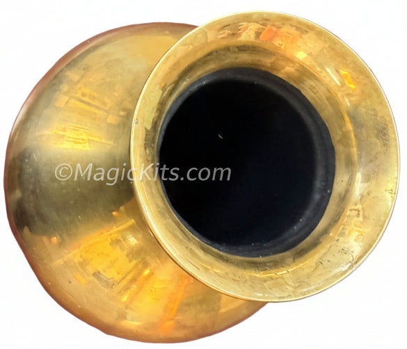 Brass vase on a wooden surface