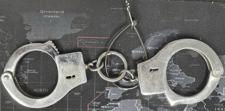 Handcuffs on a map background
