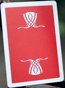 Red card with white symbols on a metal surface