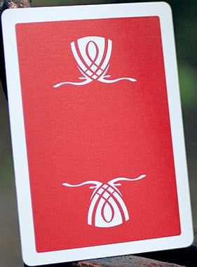 Red card with white symbols on a metal surface
