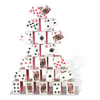 Stack of playing cards arranged in a pyramid shape on a white background