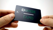 Person holding a black card with 'Charge Card' text on a white background
