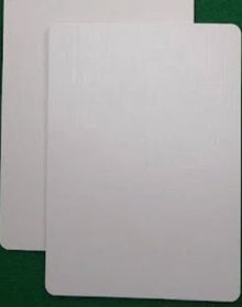 Two white cards on a green background
