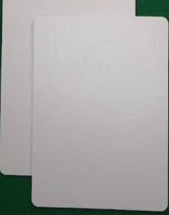Two white cards on a green background