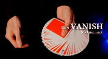 Card trick with 'Vanish' skirt and 'No Gimmick' text on a dark background