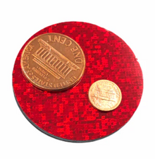 Gold coin on a red circular stand with a white background