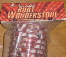 Promotional item for 'The Incredible Burt Wonderstone' movie with a red and gold design.