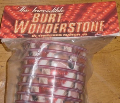 Promotional item for 'The Incredible Burt Wonderstone' movie with a red and gold design.