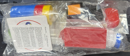 Colorful items including a red box, blue container, and an orange object on a white background with text.