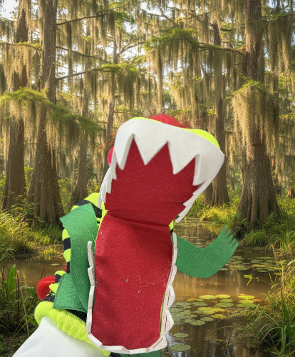 Colorful felt dinosaur toy on a wooden chair