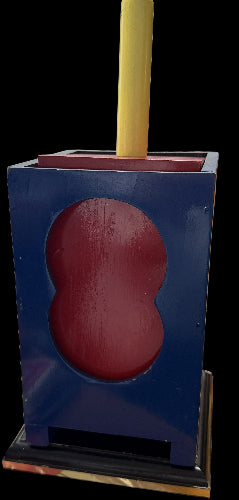 Blue holder with a red object inside on a wooden surface