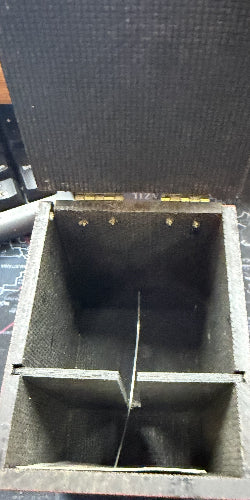 Empty wooden box with compartments on a desk