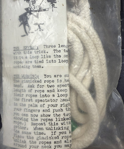 Gimmicked rope with instructions on a transparent background