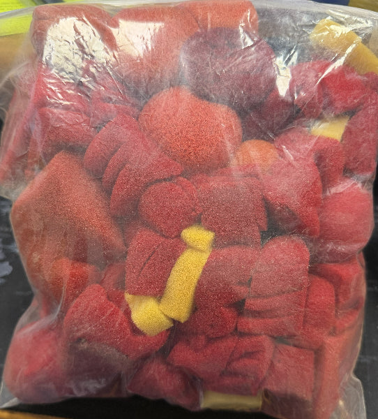 Bag of red sponge balls with yellow rabbits.