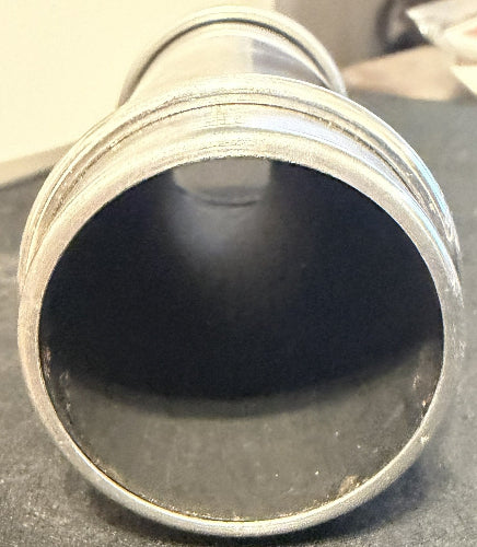 Close-up of a metal pipe with a dark interior