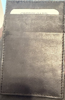 Black leather wallet with a visible credit card inside