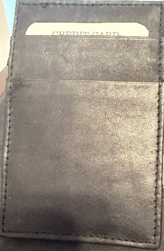 Black leather wallet with a visible credit card inside