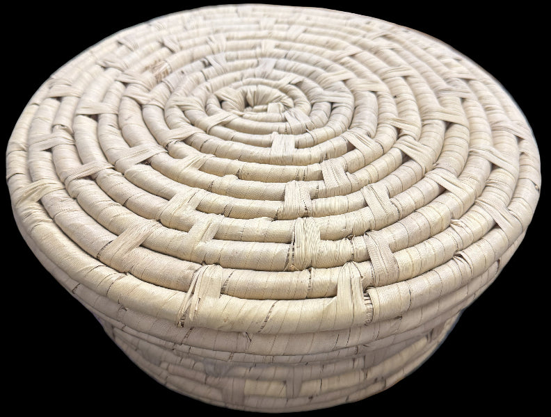 Woven beige stool on a blurred background