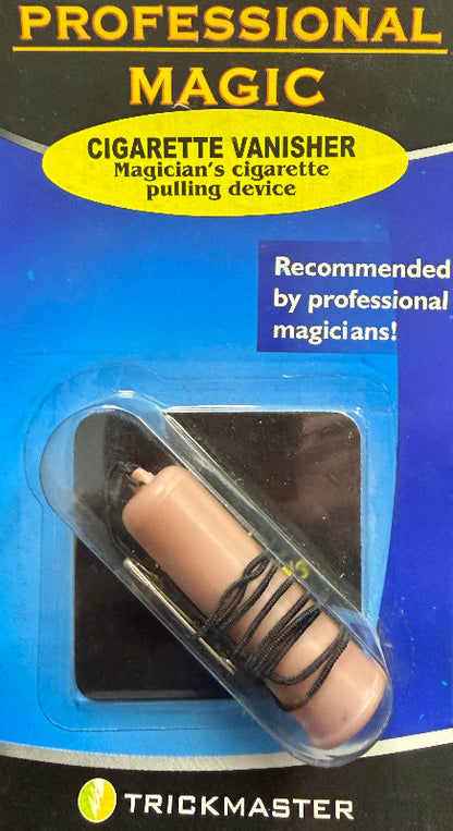 Cigarette vanisher in packaging with 'Trickmaster' branding on a dark surface.