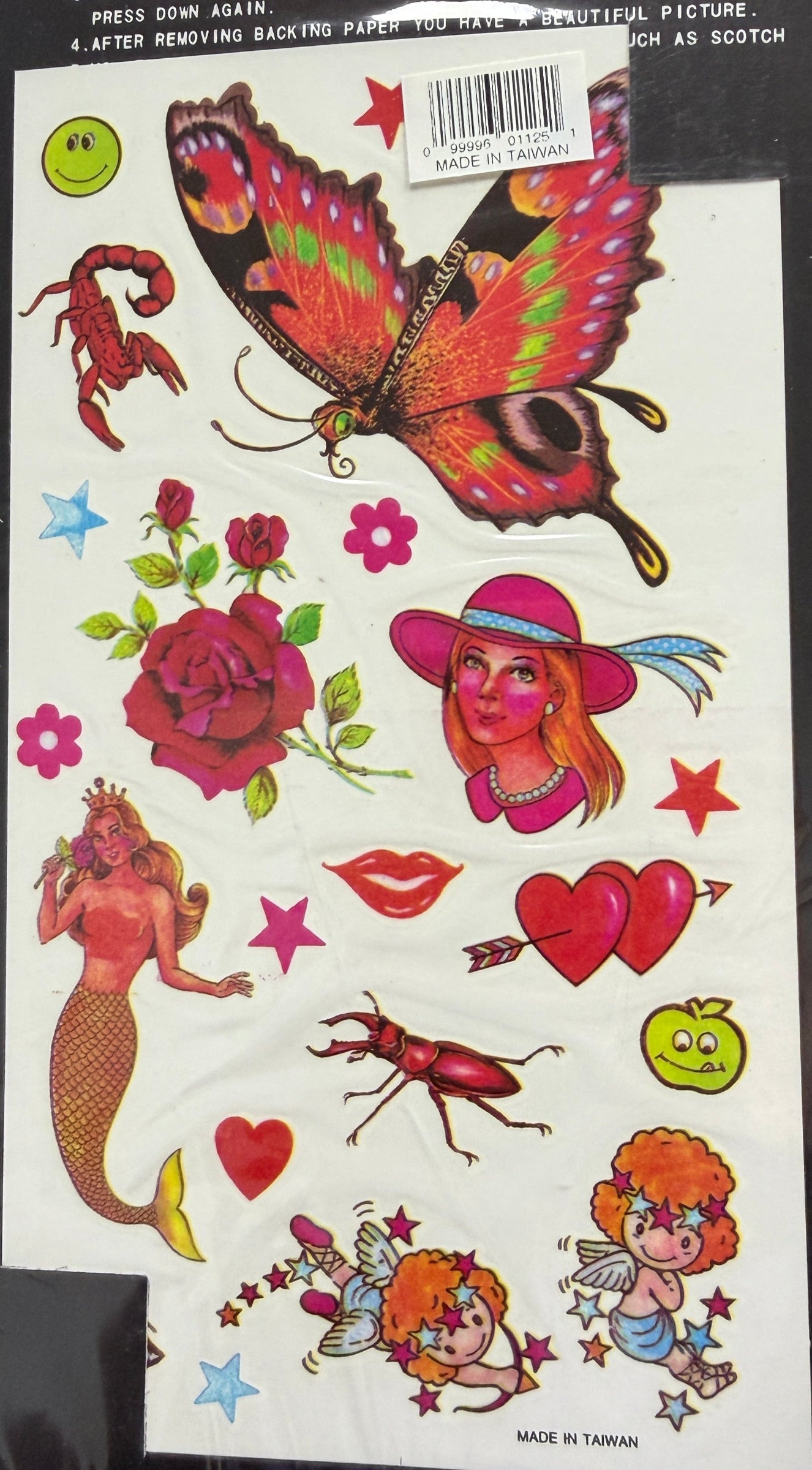 Packaging of removable tattoos with colorful designs on a black background