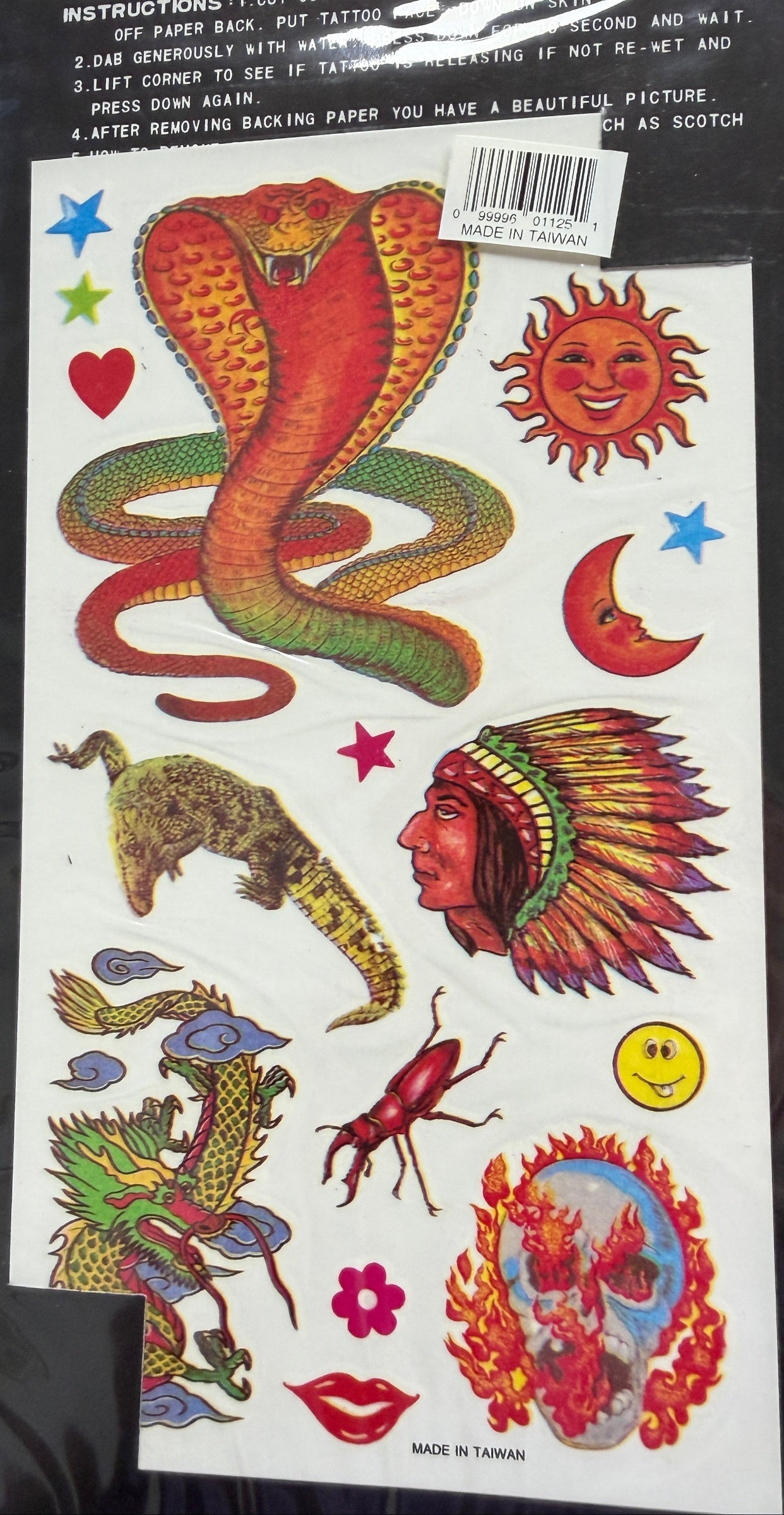 Sheet of colorful temporary tattoos with various designs on a black background.