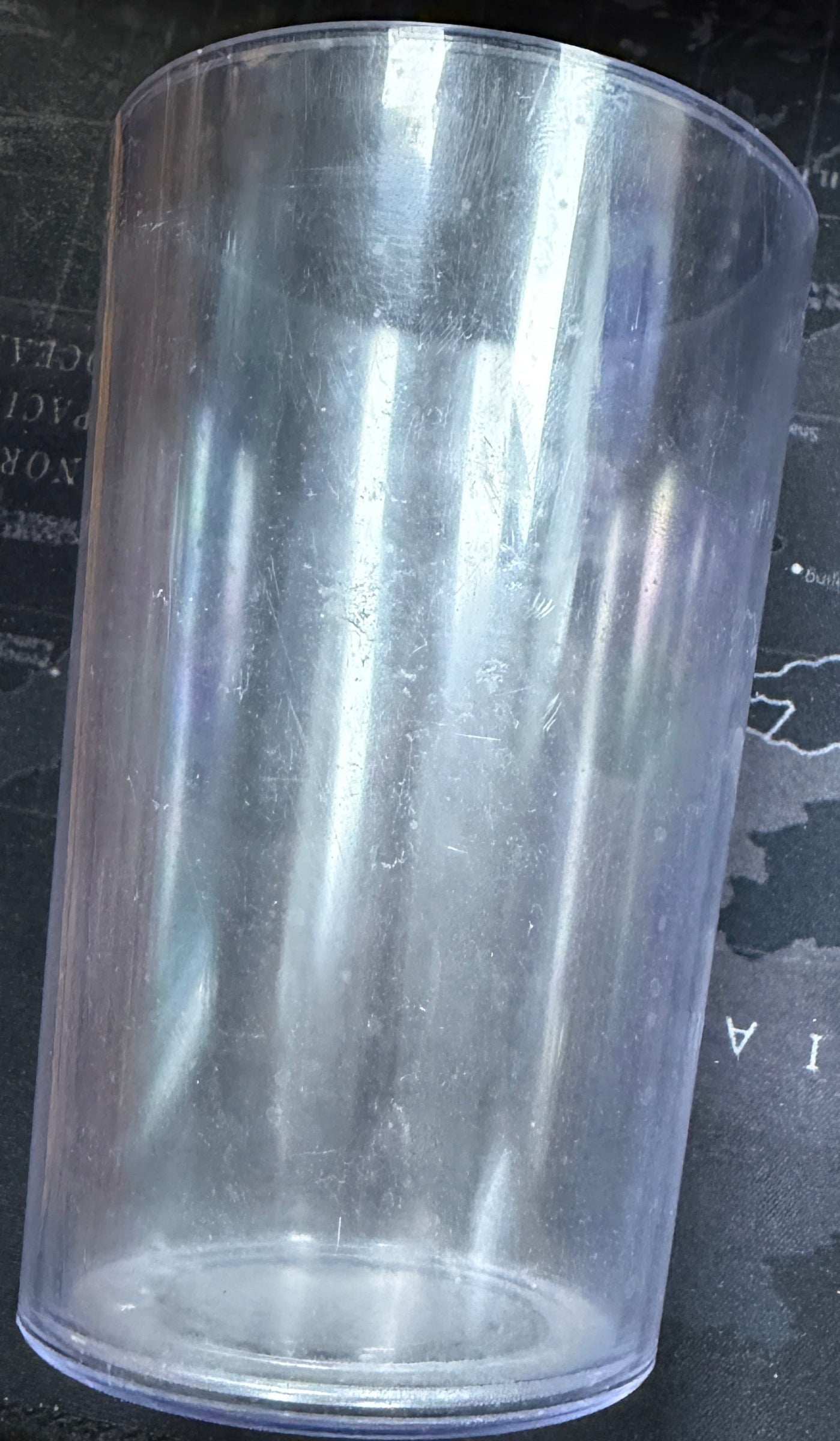 Clear plastic cup on a map of Russia