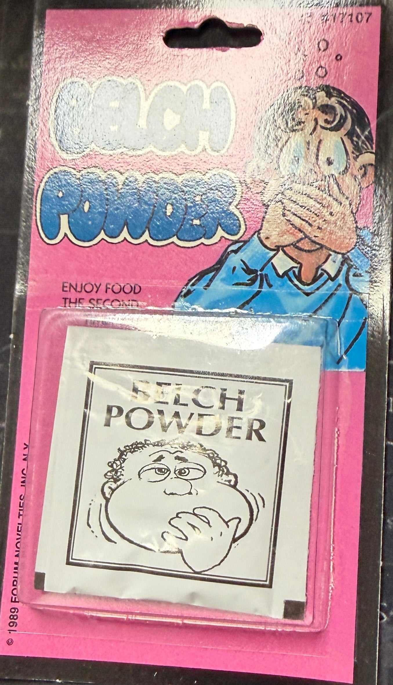 Pink packaging with cartoon character on a dark textured background