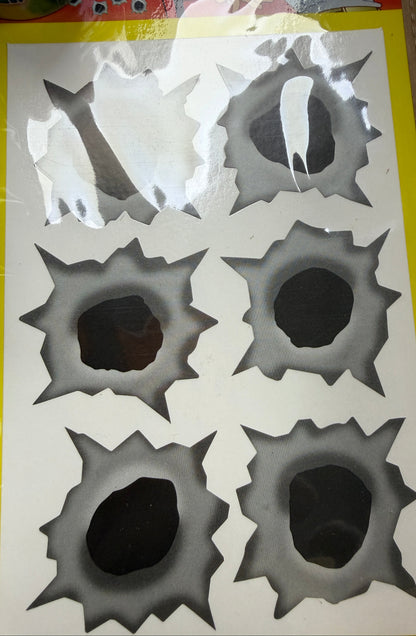 Sticker with bullet hole designs on a yellow border