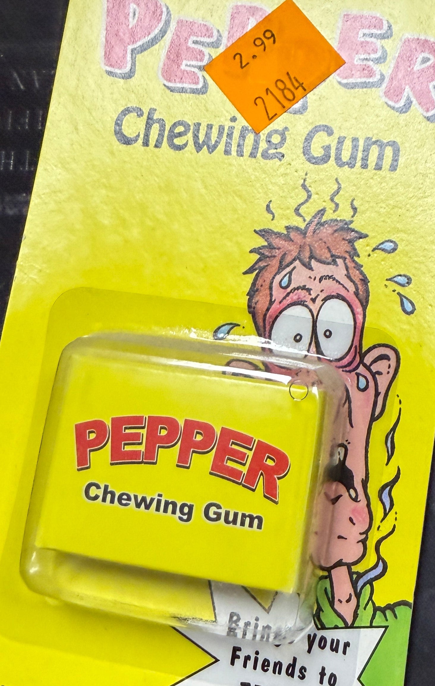 Packaged chewing gum with a cartoon character on a dark background