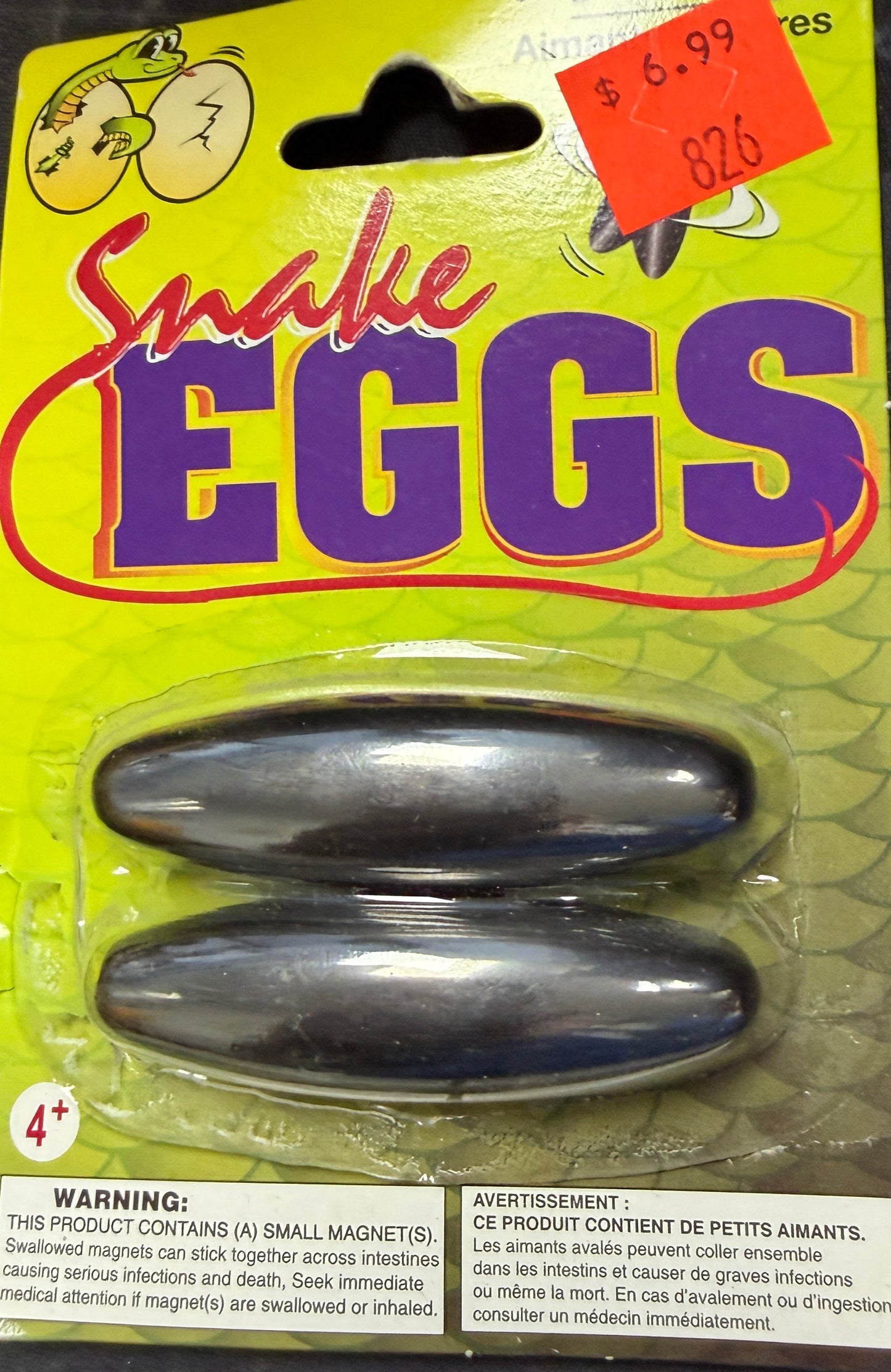 Two fishing lures in a package labeled 'Charlie Eggs' on a dark surface.