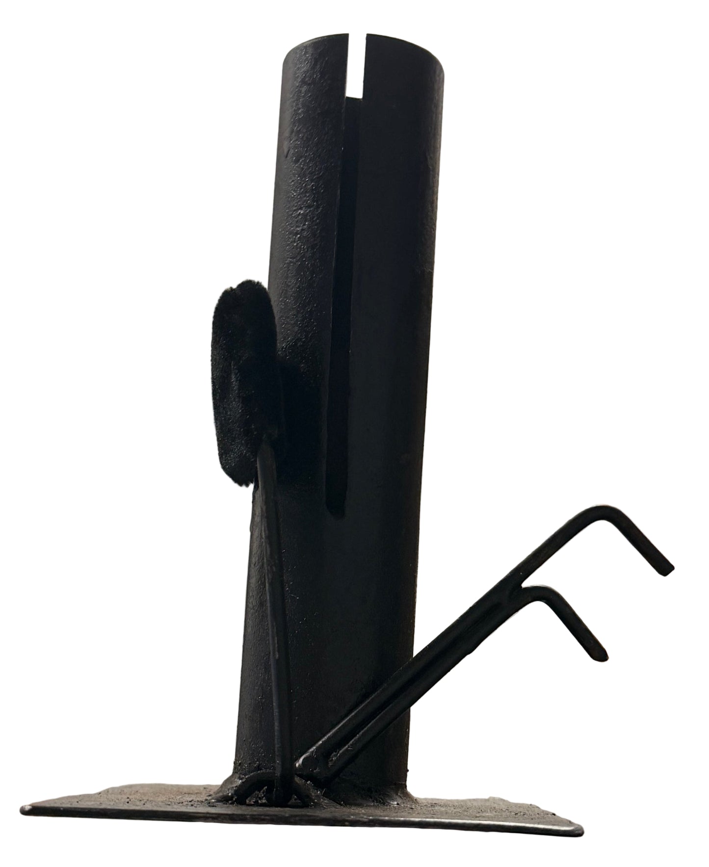 Hand holding a black metal bracket against a blurred indoor background with shelves.