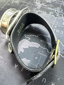 Vintage spyglass on a map background