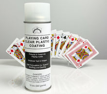 Can of playing card clear plastic coating on a dark surface