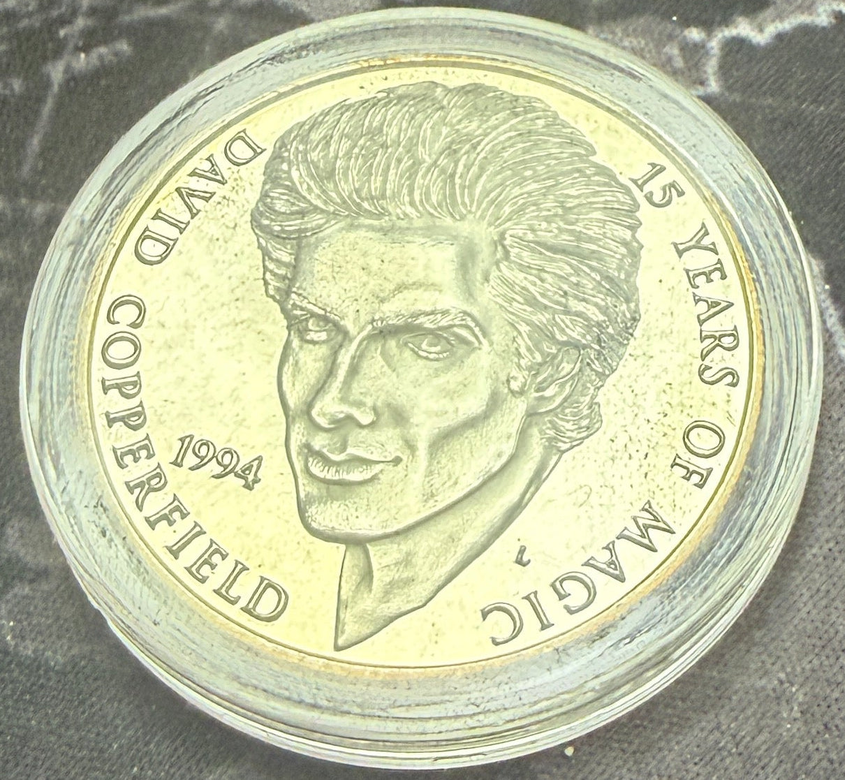 Coin with a character design on a map background