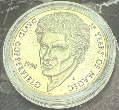 Coin with a character design on a map background