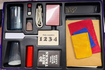 Collection of magic tricks and props in a box