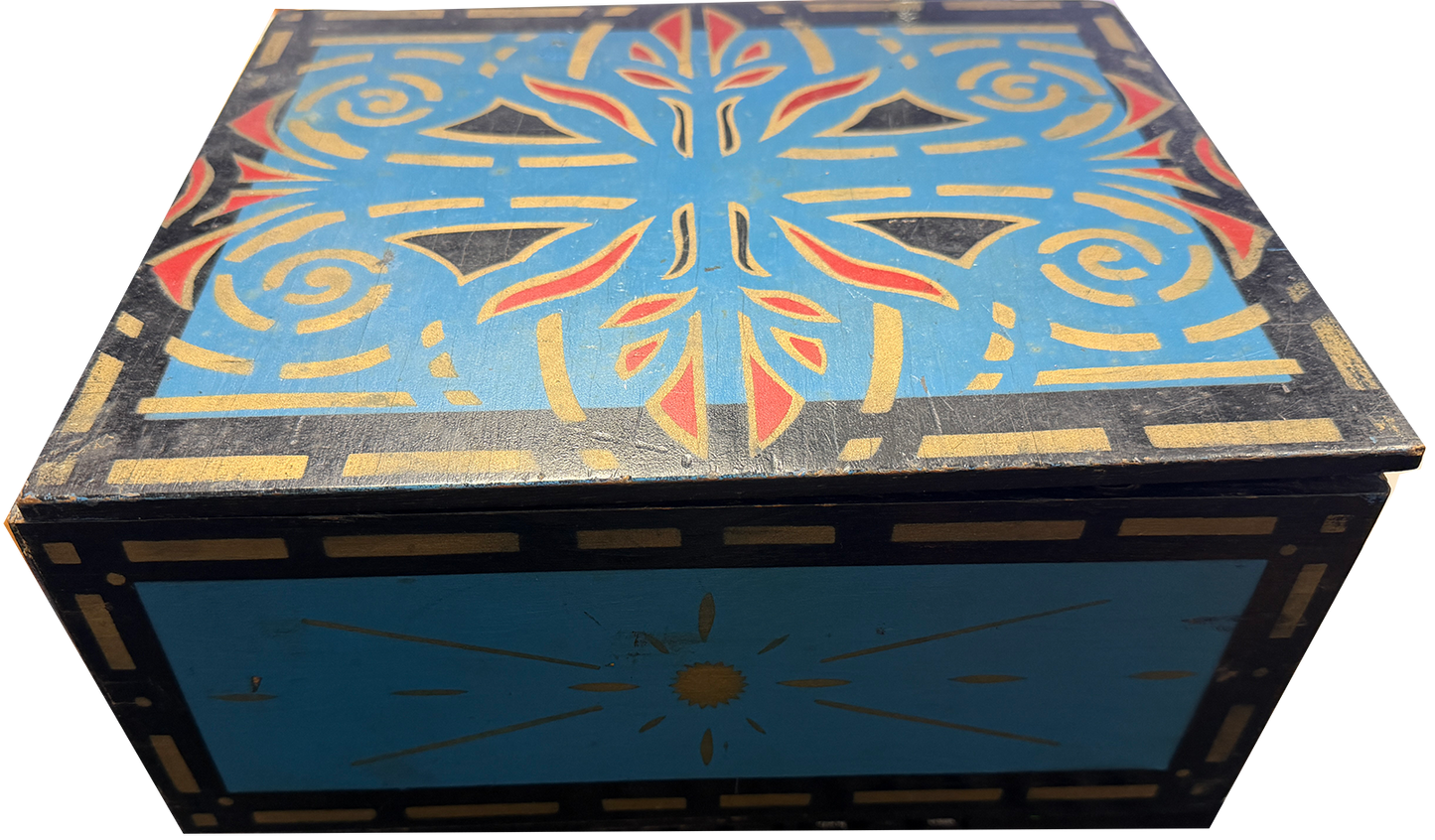 Decorative wooden box with geometric pattern on a white background