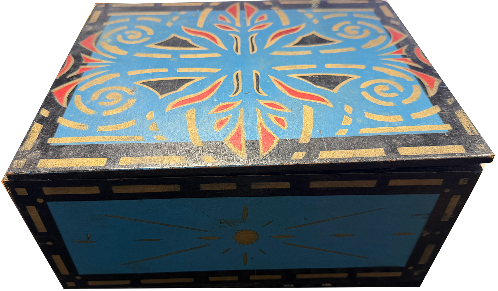 Decorative wooden box with geometric pattern on a white background