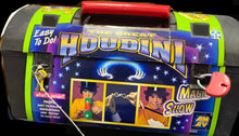 Houdini magic show kit with colorful packaging on a wooden surface