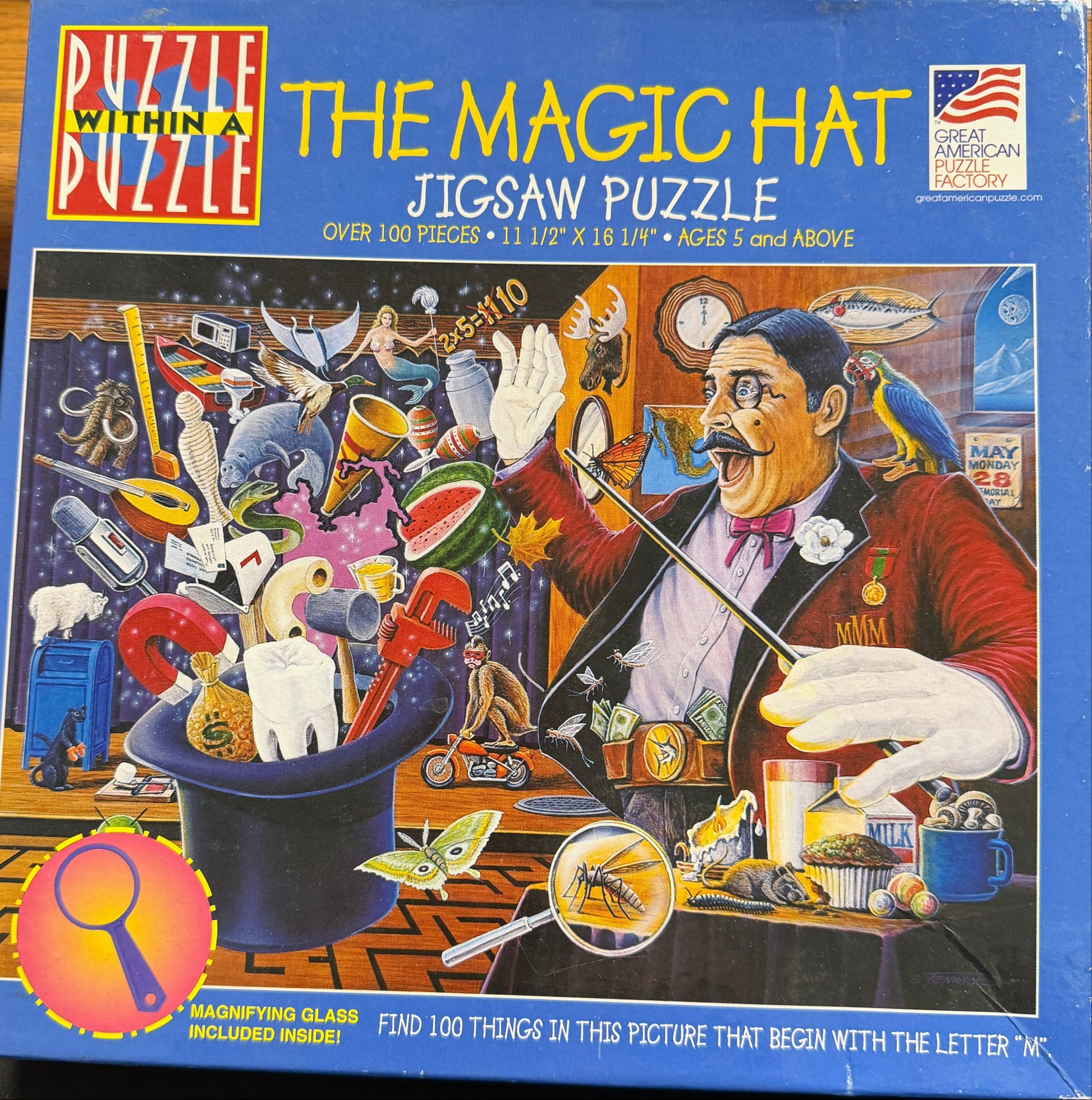 Jigsaw puzzle box titled 'The Magic Hat' by Ceaco on a table.