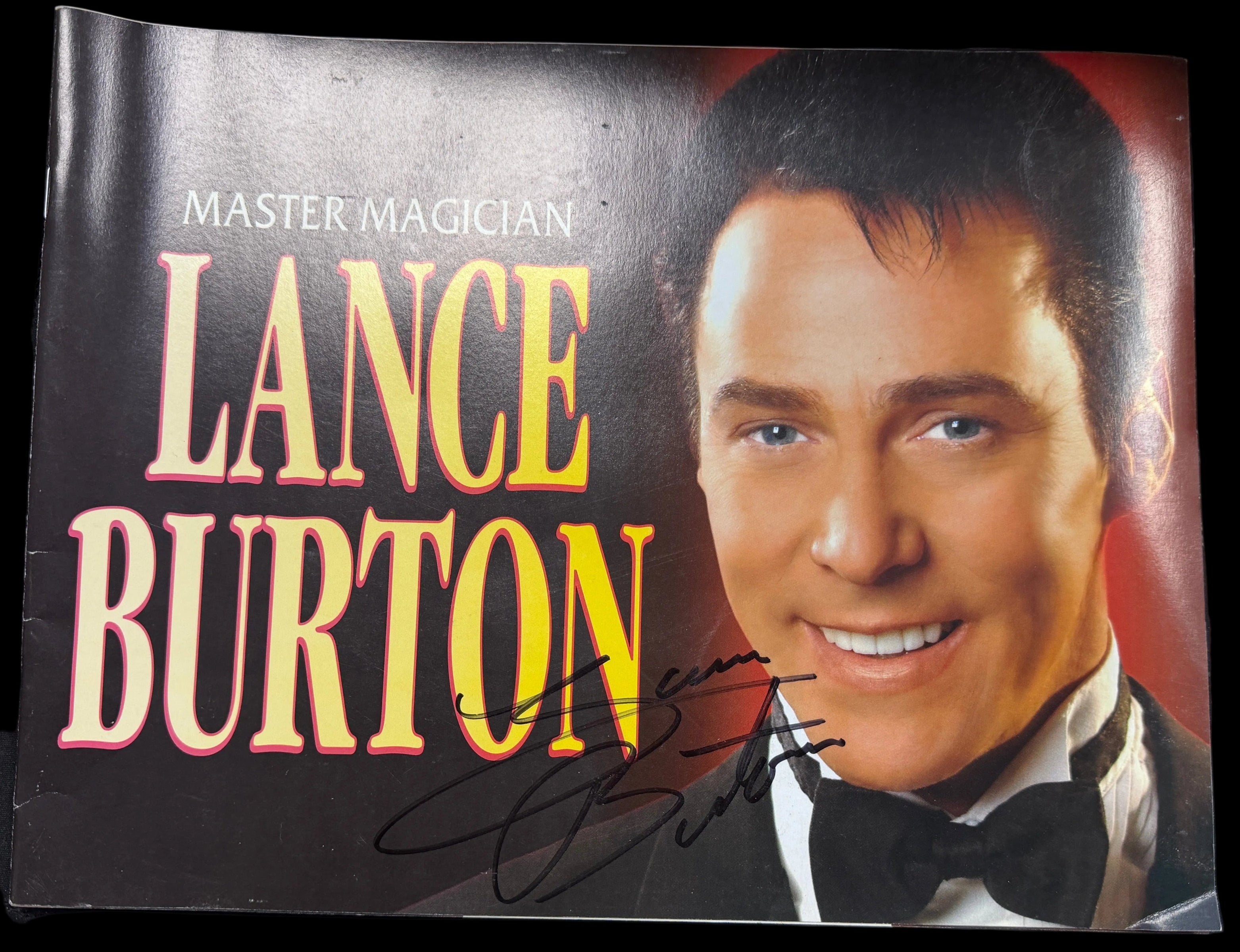 Promotional material for Master Magician Lance Burton with a portrait of the person on a dark background.
