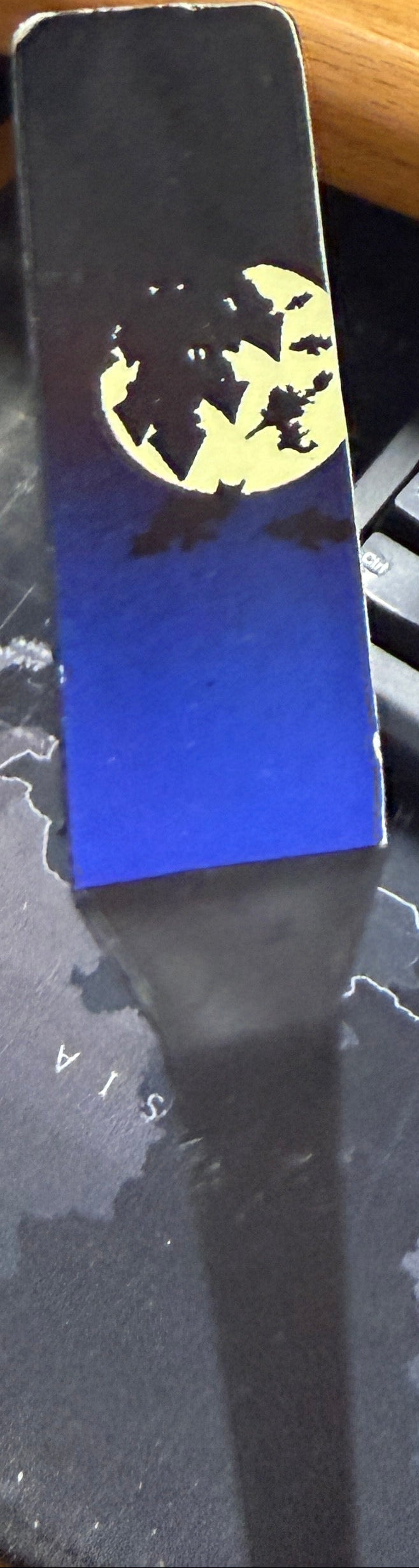 Desk with keyboard, mouse, and Batman-themed mouse pad