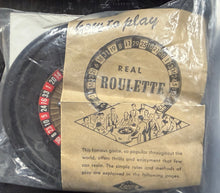 Packaged roulette set with instructions on a clear background