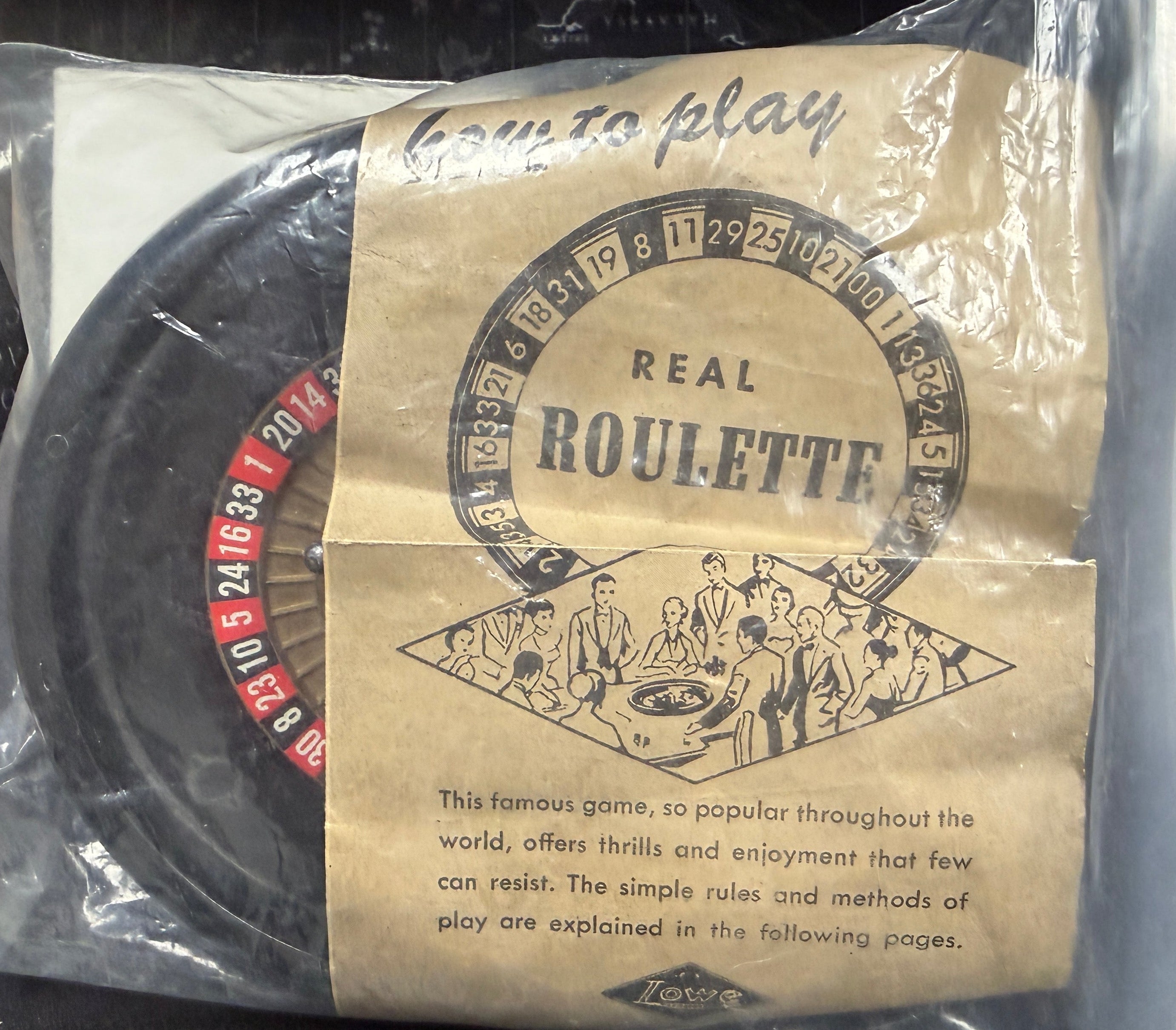 Packaged roulette set with instructions on a clear background