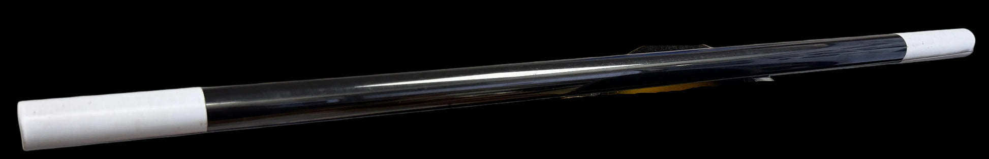 Clear cylindrical object with white ends on a black background