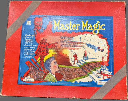 Vintage 'Master Magic' board game box with colorful graphics on a dark surface.