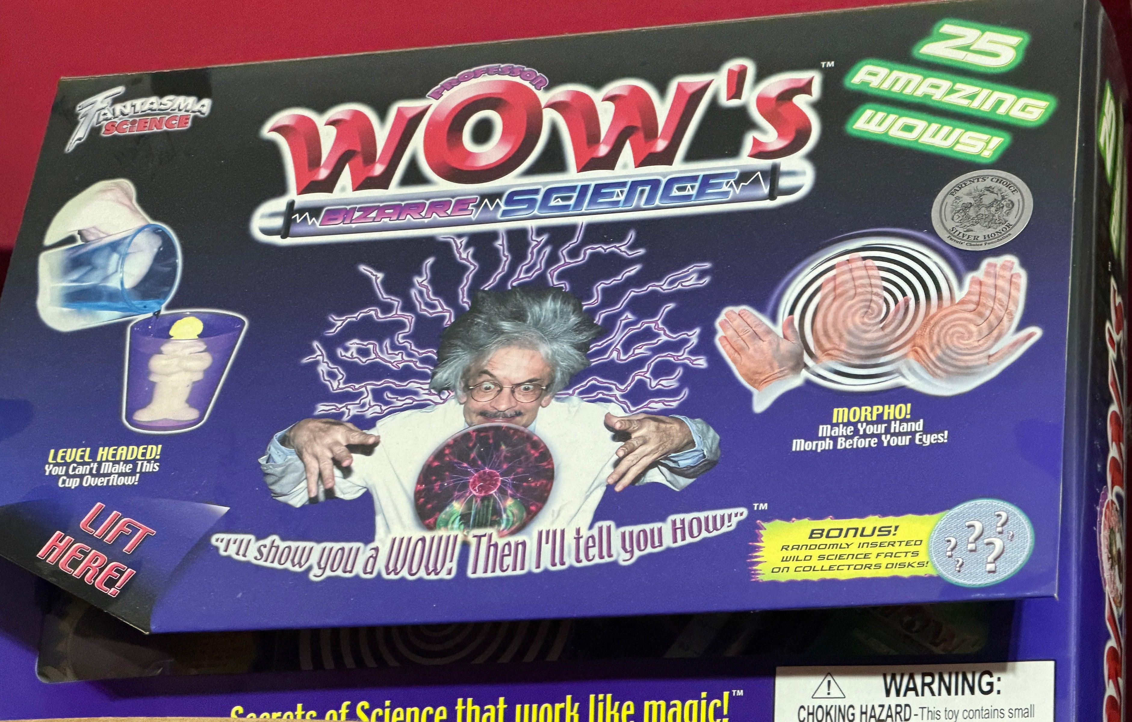 Box of 'Wow's Science' with a wizard graphic and colorful text on a red background