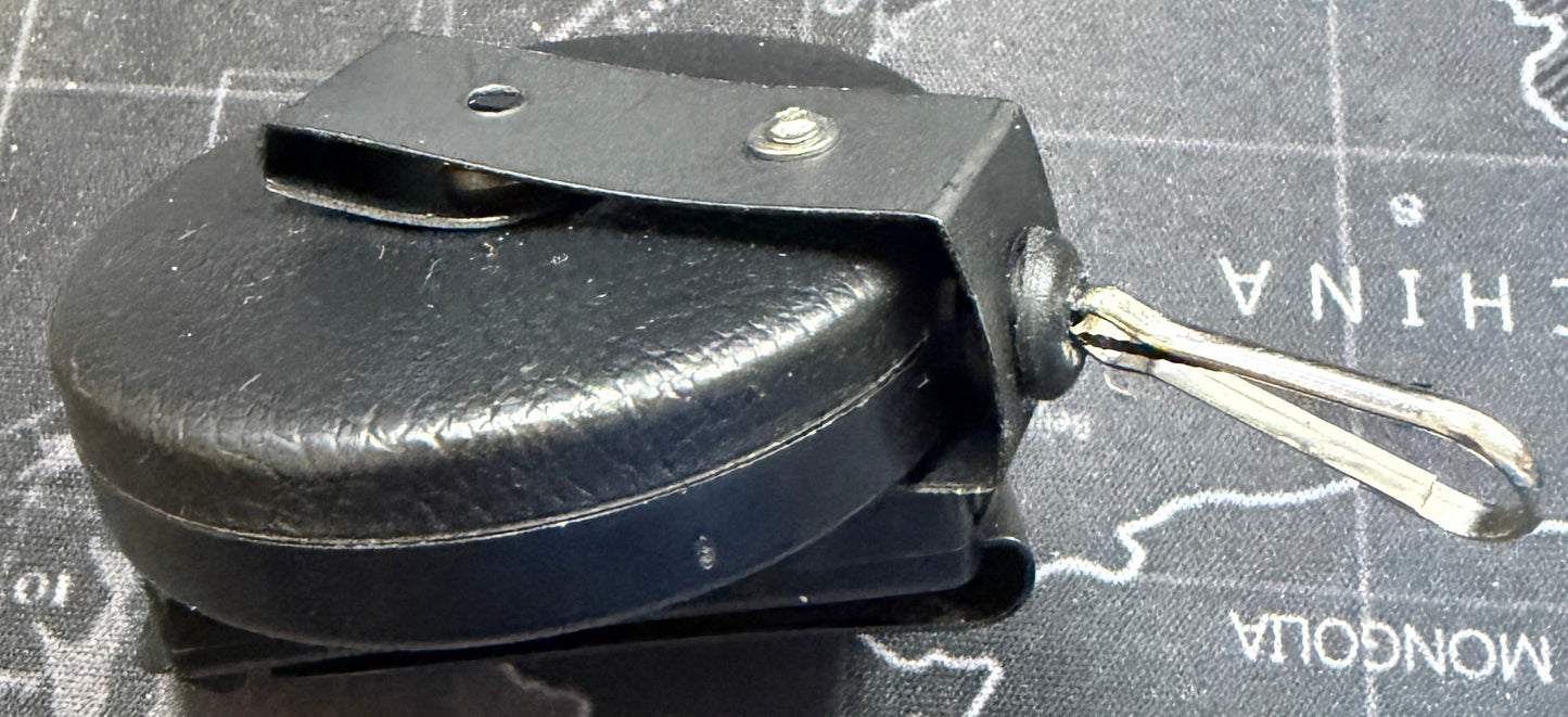 Black metal reel on a world map background