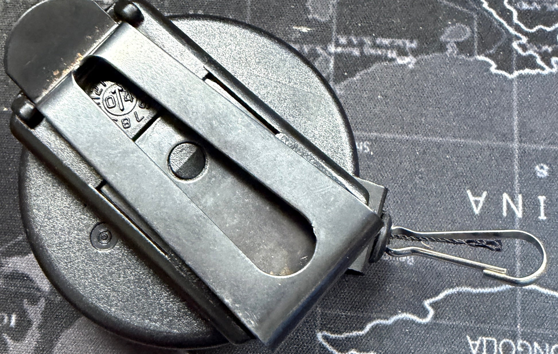 Metallic object on a world map background