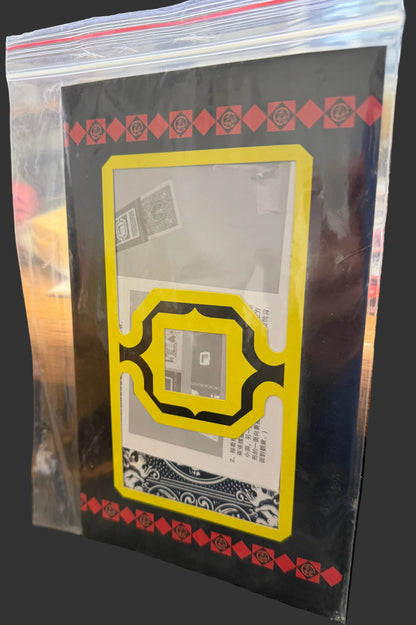 Card with decorative border in a clear plastic sleeve on a textured surface